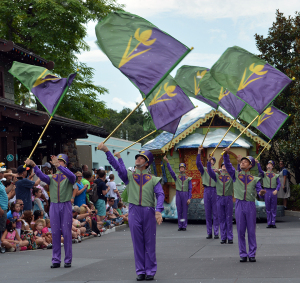 Flag twirlers Anna and Elsa's Royal Welcome Parade featuring Kristoff at Hollwood Studios in Disney World